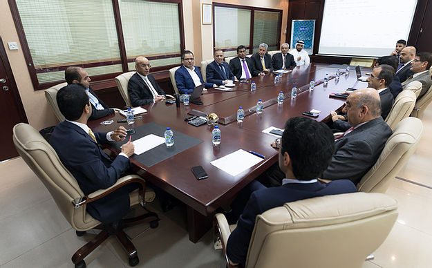 Sweet Garden management in a meeting around the boardroom table