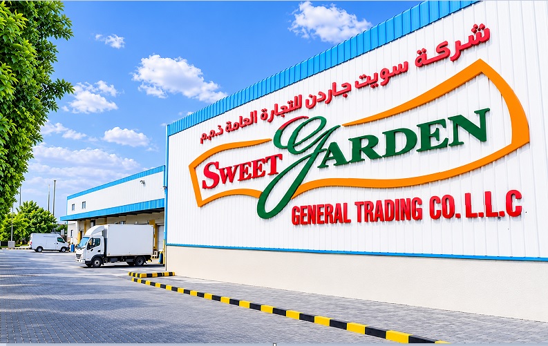 The Sweet Garden head office and warehouse building in Dubai Investment Park, with a delivery truck outside